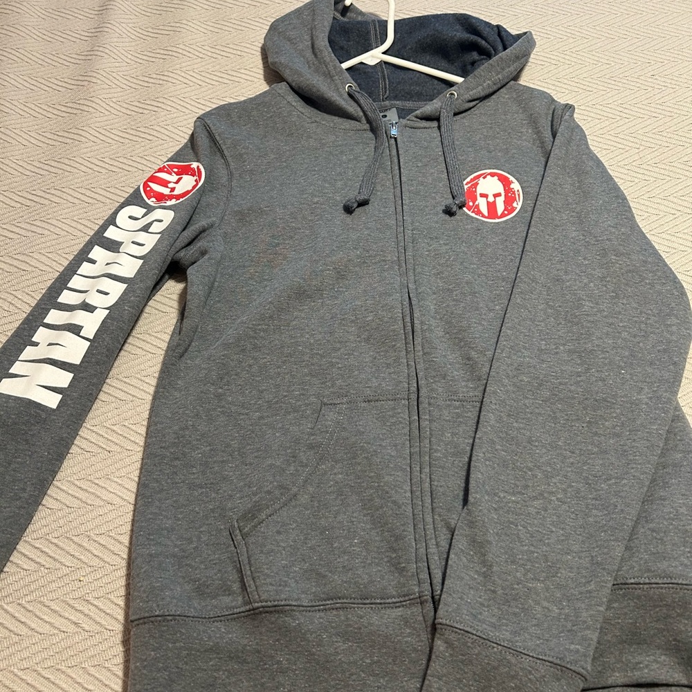Womens Spartan zip up sweatshirt. Brand new. Never worn. Size Large.